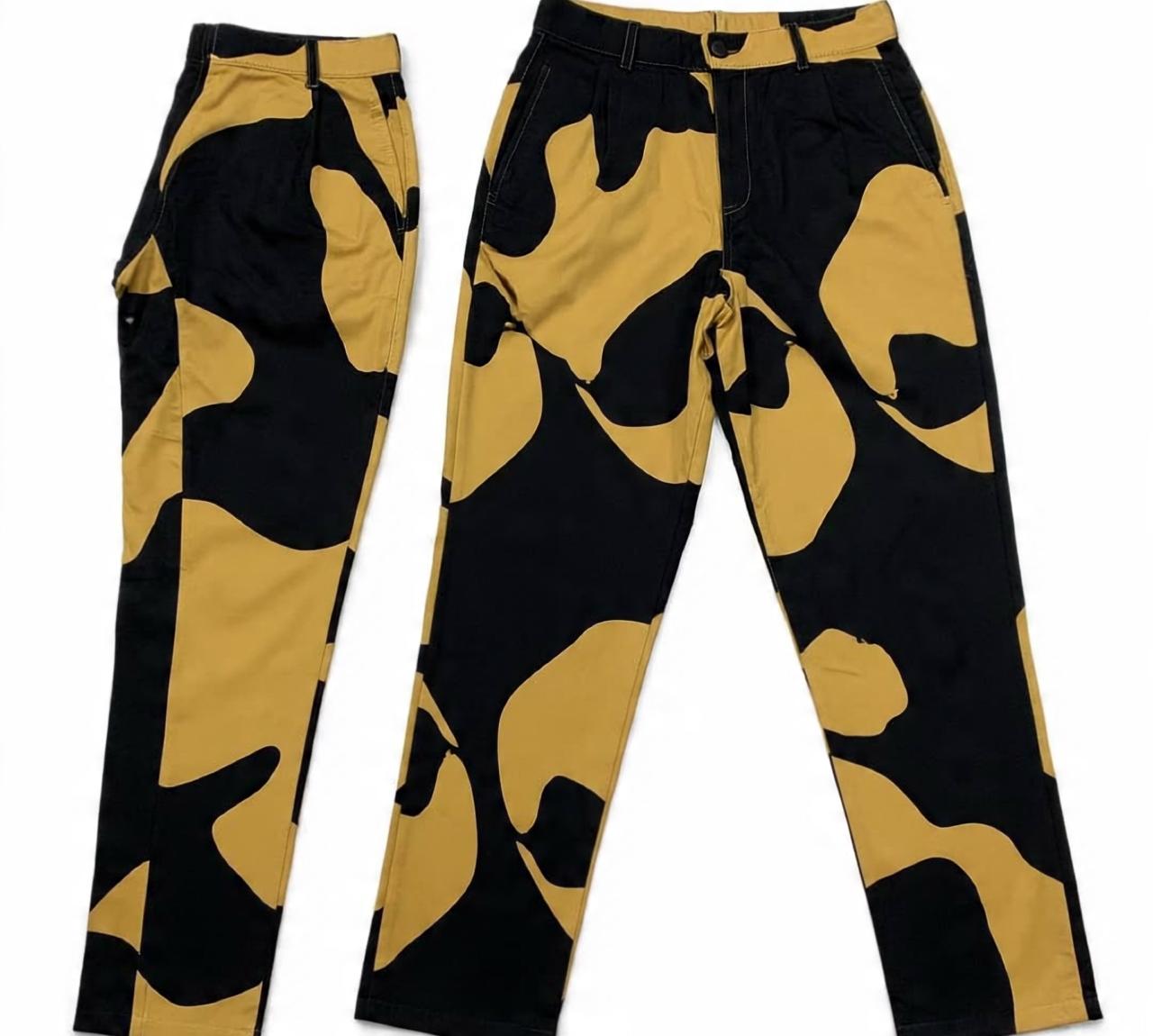slim_fit_pants_with_bold_black_and_gold_abstract_print